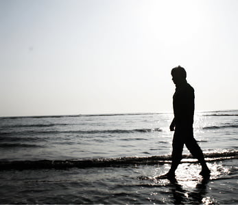 silhoutte of person near body of water thumbnail
