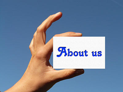 person holding card with about us text thumbnail
