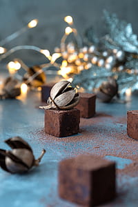 selective focus photography of gray ornament near string lights thumbnail