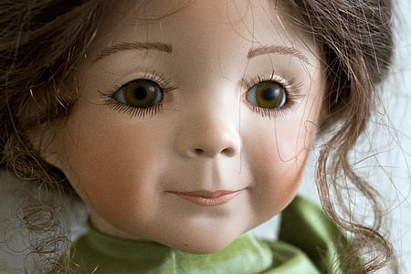 girl doll wearing green to thumbnail