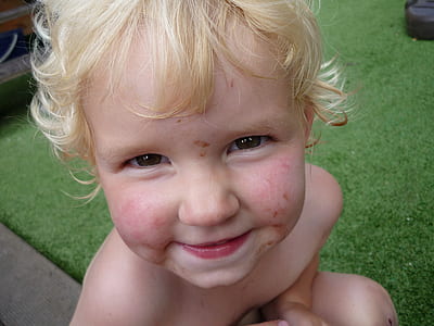 boy with blonde hair smiling thumbnail