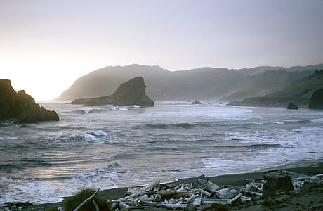 Scenic View of an Ocean with rocky shores in the background thumbnail
