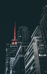 selective color photography of red H & M building thumbnail