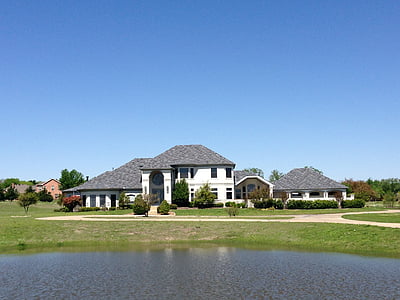white concrete house near pnd at daytime thumbnail