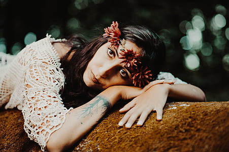 woman lying on tree part thumbnail