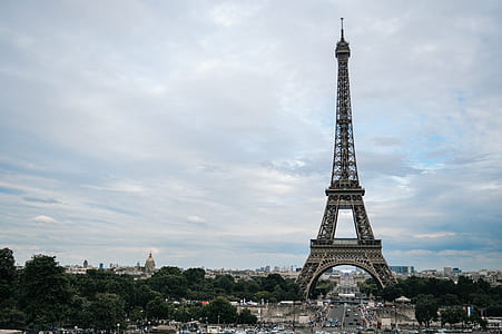 Eiffel Tower under cloudy blue sky thumbnail