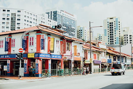 white and orange building near the road thumbnail