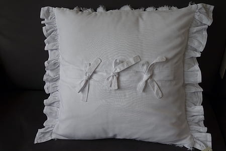 square white throw pillow on black surface thumbnail