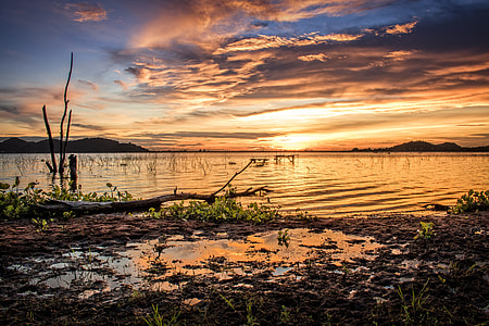 calm body of water during sunset thumbnail