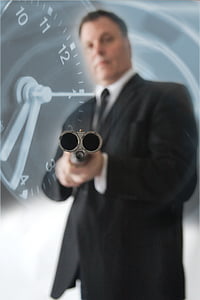 person holding gray rifle with watch background wallpaper thumbnail