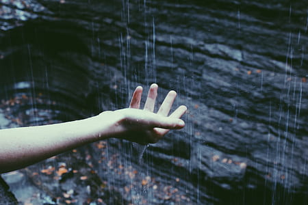 person touching the raindrops thumbnail