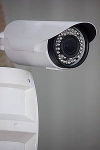 white and black security camera thumbnail