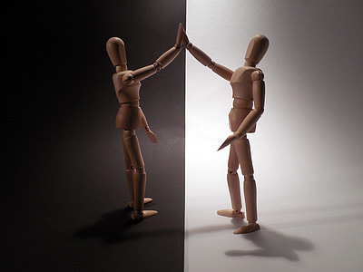 two brown wooden artists manikin collage thumbnail