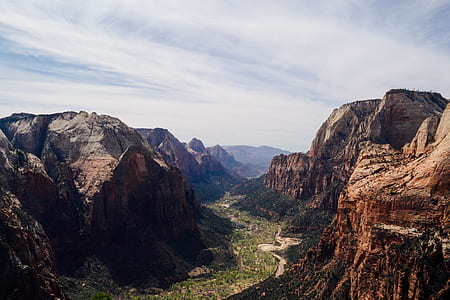 aerial view photography of cliff under cloudy sky thumbnail