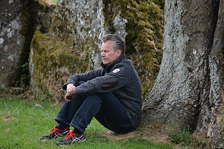 man leaning on near tree thumbnail