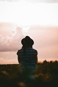 woman wearing black cowboy hat thumbnail