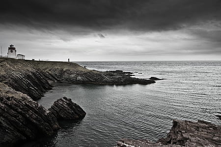 lighthouse beside seashore thumbnail