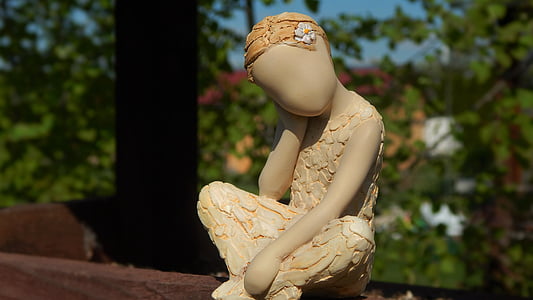 female statuette outdoors thumbnail