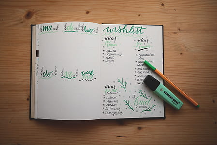 green marker on journal notebook thumbnail