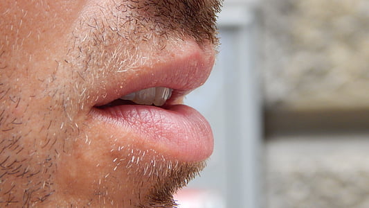 closeup photo of person's mouth thumbnail