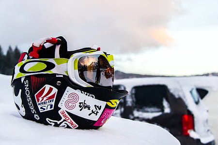 black and white half helmet with snow goggles thumbnail