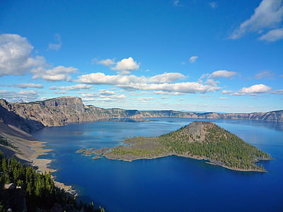 aerial photography of islet under blue sky thumbnail