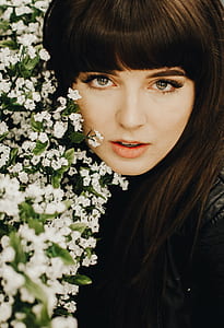 woman beside white flowers thumbnail