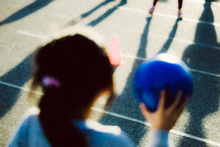 person holding blue ball thumbnail