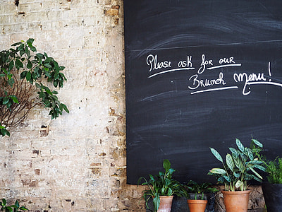 black chalkboard beside green plants thumbnail
