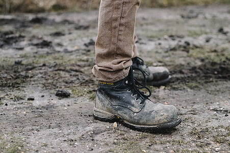 person wearing black leather work boots outdoor during daytime thumbnail
