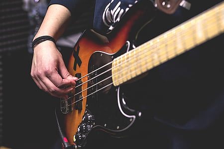 black and orange electric bass guitar thumbnail