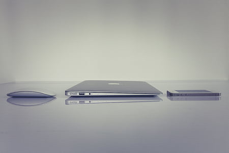 Apple products on top of gray surface thumbnail