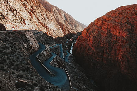 photography of river surrounded by mountains during daytime thumbnail
