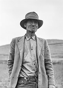 gray scale photo of man in suit jacket thumbnail