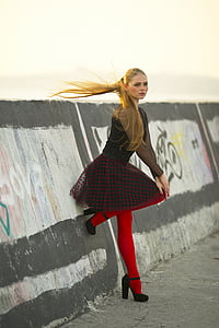 woman wearing black and red polka-dot dress thumbnail