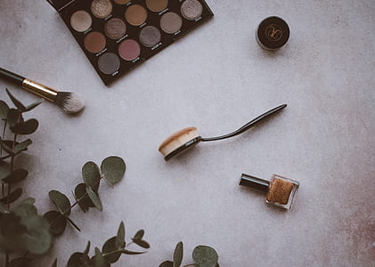 assorted cosmetics on desk thumbnail