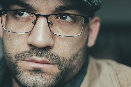 selective focus photo of man wearing eyeglasses thumbnail