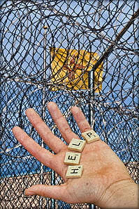 person holding help scrabble tile thumbnail