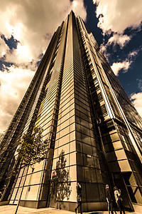 worm's-eye view of scyscraper during cloudy day thumbnail