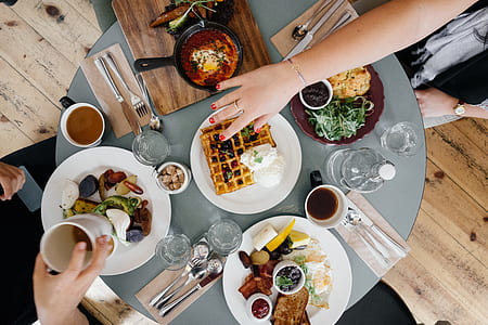 foods on white plates on round table flatlay photography thumbnail