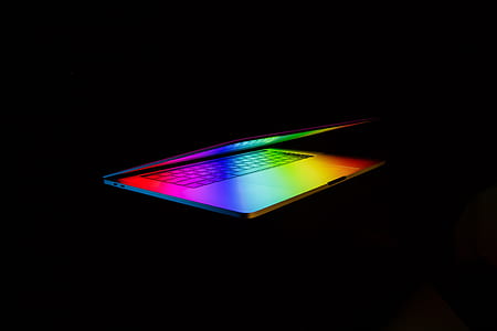 silver laptop on black surface thumbnail
