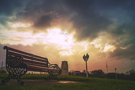 Black Steel Frame Brown Wooden Bench during Daytime thumbnail