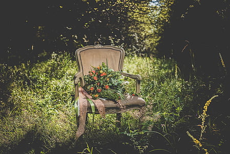 white wooden chair with flowers thumbnail