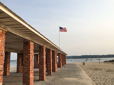 U.S.A. flag pole beside seashore thumbnail