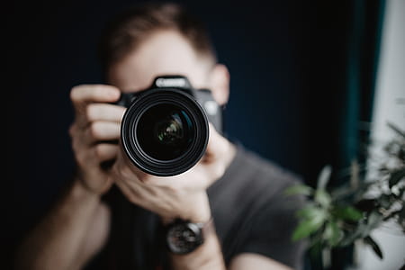 Young man taking photos thumbnail