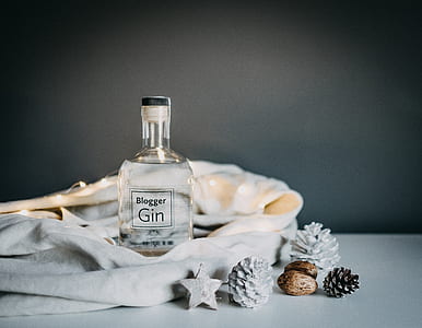 Blogger Gin on white white beside pine cone, star and pineapple figurines thumbnail