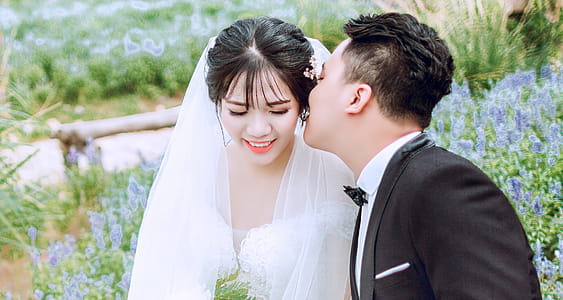 Groom Kissing Bride on Left Cheek thumbnail