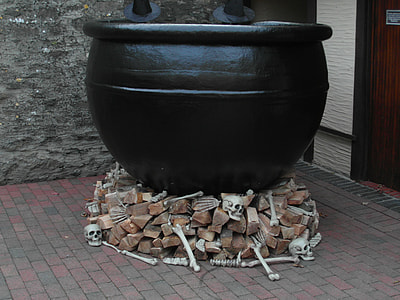black ceramic pot on firewoods thumbnail