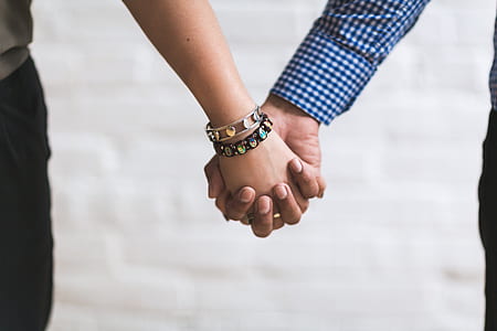 man and woman's hands tightly held thumbnail