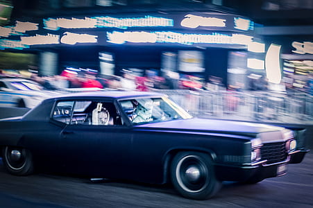 black muscle car on road thumbnail